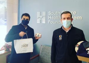 Dave Ellis and Keith Singh Presenting Gifts To South Shore Health
